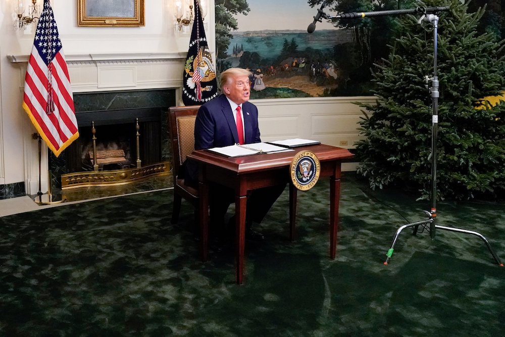 President Donald Trump participates in a Thanksgiving video teleconference with members of the military forces, at the White House in Washington Nov. 26. (CNS/Reuters/Erin Scott)