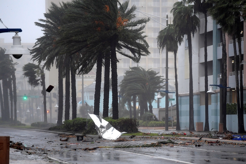 Debris flies through the air Oct. 7, 2016, as the eye of Hurricane Matthew nears Daytona Beach, Florida. (CNS/Reuters/Phelan Ebenhack)
