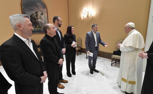 Pope Francis greets filmmaker Evgeny Afineevsky and others involved with the production of the documentary, "Francesco," before the papal general audience at the Vatican Oct. 21. (CNS/Vatican Media)