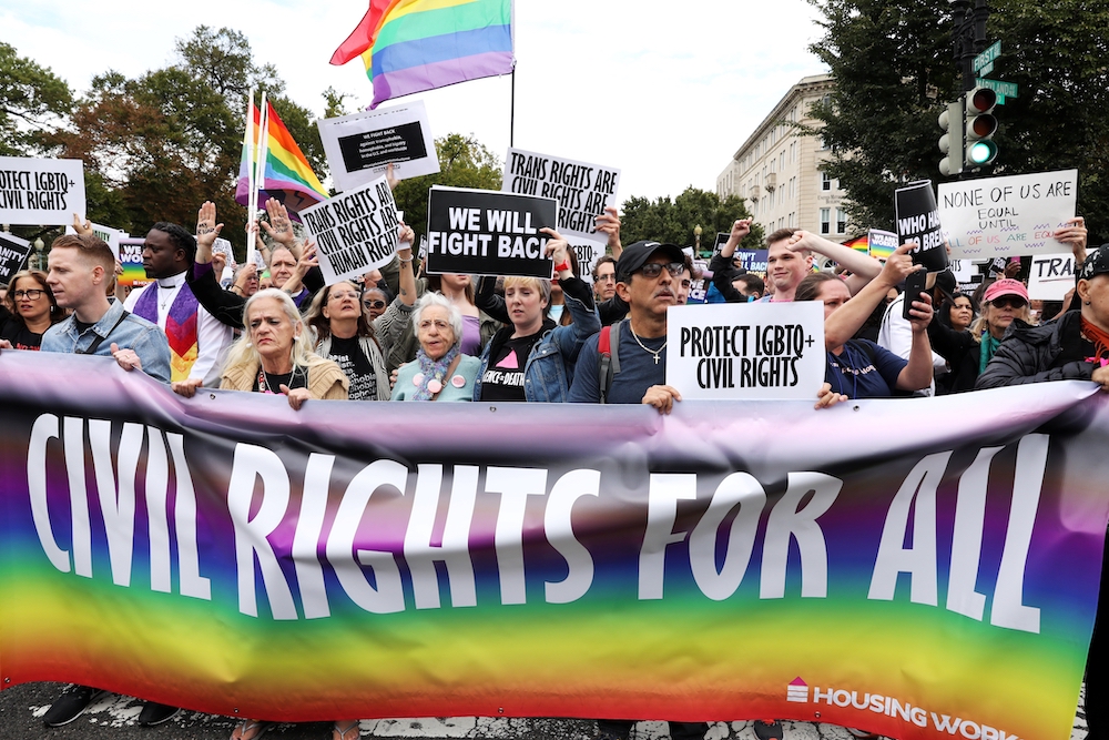 Activists and supporters block the street outside the U.S. Supreme Court in Washington Oct. 8, 2019. The court will hear oral arguments on Nov. 4, 2020, in a case pitting religious liberty against the a non-discrimination law protecting LGBTQ people. (CNS
