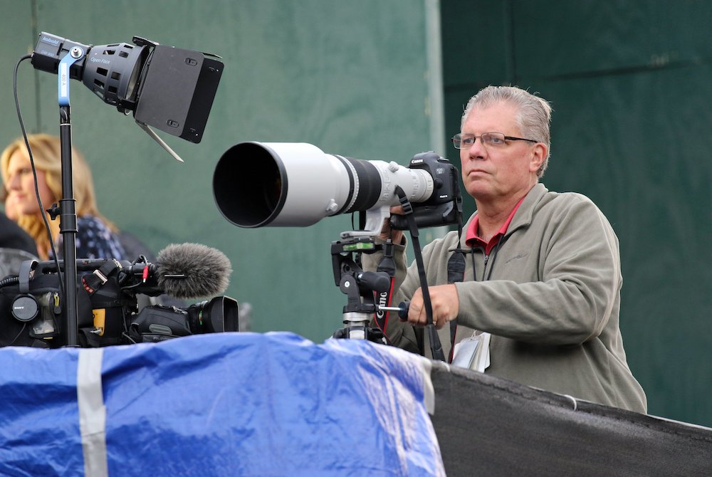 Catholic News Service staff photographer Bob Roller waits for the arrival of Pope Francis at the Festival of Families during the World Meeting of Families in Philadelphia Sept. 26, 2015. (CNS/Gregory A. Shemitz)