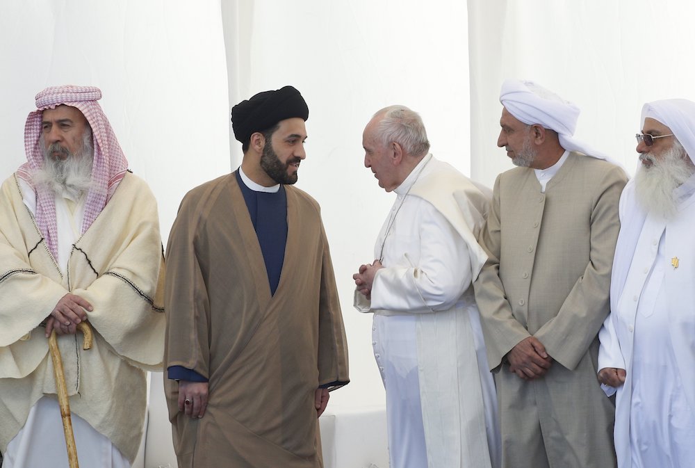 Pope Francis talks with a religious leader during an interreligious meeting on the plain of Ur near Nasiriyah, Iraq, March 6, 2021. (CNS/Paul Haring) Pope Francis talks with a religious leader during an interreligious meeting on the plain of Ur near Nasiriyah, Iraq, March 6, 2021. (CNS/Paul Haring)
