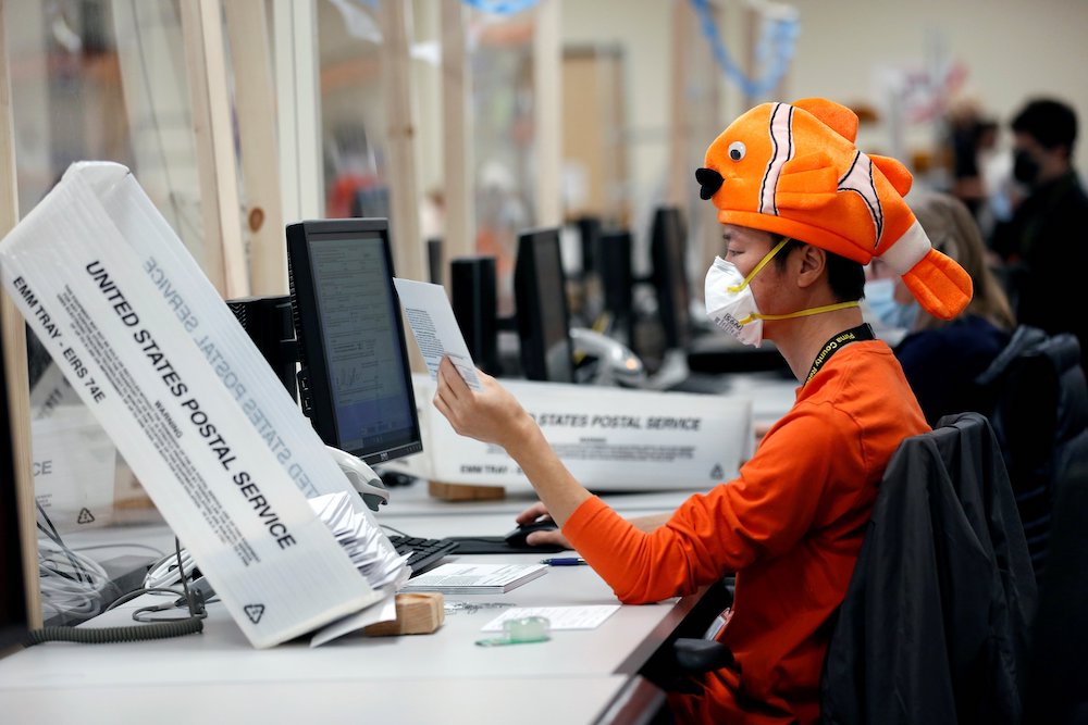 An employee in Tucson, Arizona, wears a Halloween costume Oct. 31 while processing early voting and absentee ballots ahead of the upcoming presidential election Nov. 3. (CNS/Reuters/Cheney Orr) An employee in Tucson, Arizona, wears a Halloween costume Oct. 31 while processing early voting and absentee ballots ahead of the upcoming presidential election Nov. 3. (CNS/Reuters/Cheney Orr)
