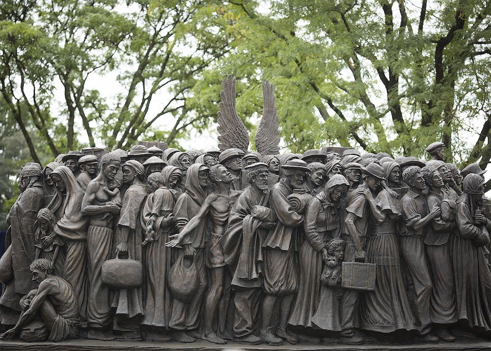 "Angels Unawares" by Timothy Schmalz seen on the campus of Catholic University of America in Washington, D.C., Sept. 27. The life-size sculpture, which depicts a group of migrants and refugees crowded on a boat, is a replica of the one Pope Francis unveil