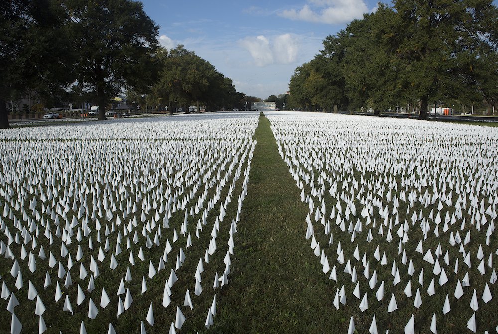 A temporary memorial for the victims of COVID-19 is seen near the armory in Washington Oct. 23. Each day the artist adds new flags to the installation as the death toll rises. As of Oct. 29, about 228,000 Americans have died from the disease. (CNS/Tyler O