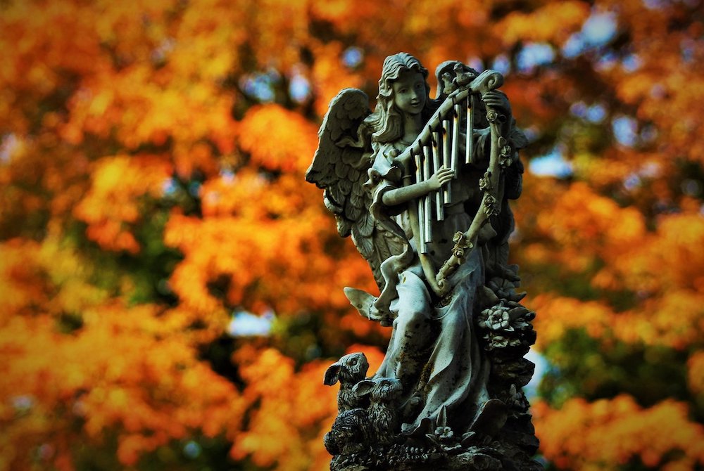 An angel statue set off by fall foliage at St. Margaret's Catholic Cemetery in Neenah, Wisconsin, Sept. 22 (CNS/Brad Birkholz)
