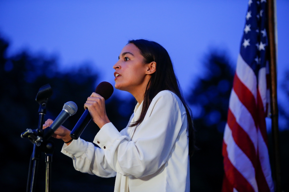 U.S. Rep. Alexandria Ocasio-Cortez speaks to people as they gather for a vigil Aug. 5, 2019, at Grand Army Plaza in Brooklyn, New York, to remember victims of the mass shootings in Dayton, Ohio, and El Paso, Texas. (CNS/Reuters/Eduardo Munoz)