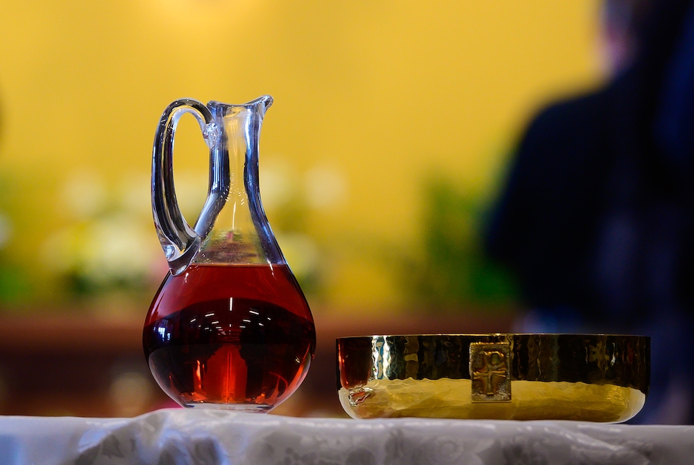 A cruet and ciborium hold wine and bread that will become the Body and Blood of Christ during Mass inside the Mother of Mercy Hall at the National Shrine of Our Lady of Good Help in Champion, Wisconsin, April 28, 2019. (CNS/The Compass/Sam Lucero)