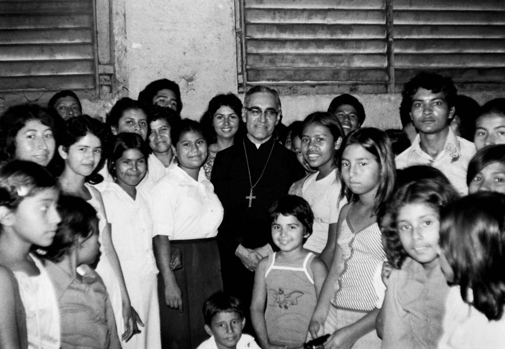 Óscar Romero with women and children