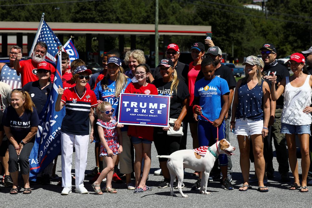 A group of supporters of President Donald Trump, holding signs and flags, in Atlanta Sept. 5 (CNS/Reuters/Dustin Chambers)