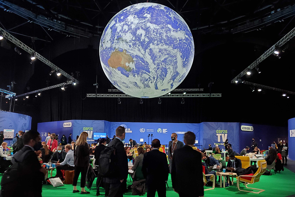 Some 20,000 delegates, and thousands more activists and advocates, are expected to attend the U.N. climate conference known as COP26, which began Oct. 31 in Glasgow, Scotland. Attendees are pictured at the summit Nov. 2. (EarthBeat photo/Brian Roewe) Some 20,000 delegates, and thousands more activists and advocates, are expected to attend the U.N. climate conference known as COP26, which began Oct. 31 in Glasgow, Scotland. Attendees are pictured at the summit Nov. 2. (EarthBeat photo/Brian Roewe)