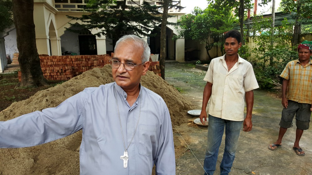 Bishop Moses Costa helps oversee construction being done on the grounds of the Cathedral of Our Lady of the Holy Rosary in Chittagong, Bangladesh, in September 2015. (NCR photo/Chris Herlinger)