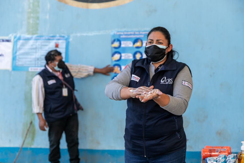 To help reduce the impact of COVID-19 in Guatemala, Catholic Relief Services personnel help people access hygiene and sanitation supplies. (Courtesy of Catholic Relief Services/Ivan Palma)