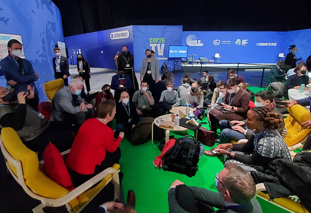 Catholics working on climate issues gather Nov. 4 between events at COP26 in Glasgow, Scotland. (EarthBeat photo/Brian Roewe)