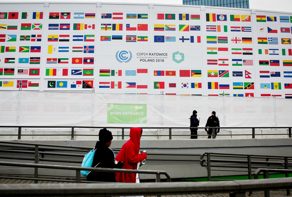 People walk past the International Congress Center during COP24, the U.N. climate change conference in Katowice, Poland, Dec. 3. (Sipa USA/NurPhoto/Mateusz Wlodarczyk) 
