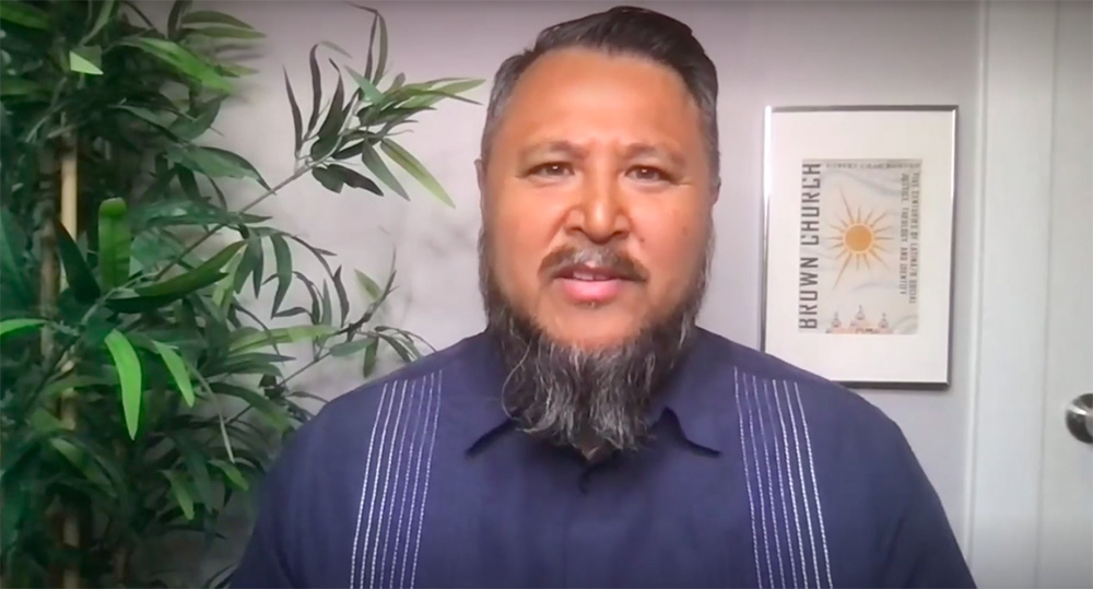 The Rev. Robert Chao Romero, a professor of Chicana/o Studies and Asian American Studies at the University of California at Los Angeles, reads his poem "I Am the Brown Church." (NCR screenshot)