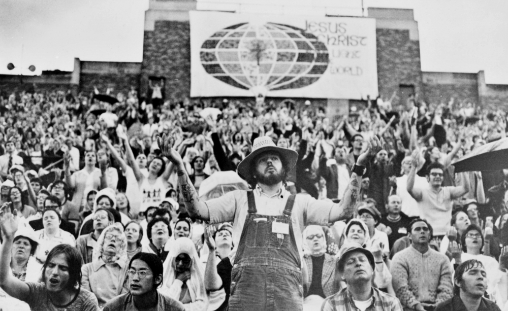 People pray during the International Conference on Charismatic Renewal at the University of Notre Dame in South Bend, Indiana, in 1974. (CNS/John Muthig)