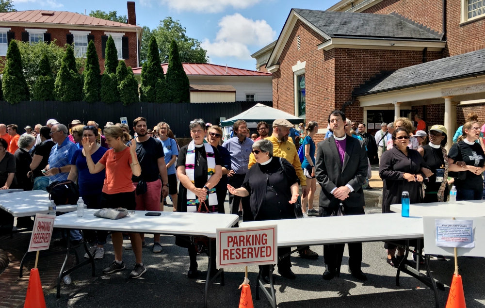 Clergy lead a gathering in song in Charlottesville, Virginia, on Aug. 12. (Flickr/Evan Nesterak)