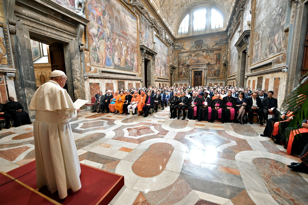 Pope Francis meets March 8 at the Vatican with representatives of the world's religious traditions and experts in the fields of development, the environment and health care. (CNS/Vatican Media)