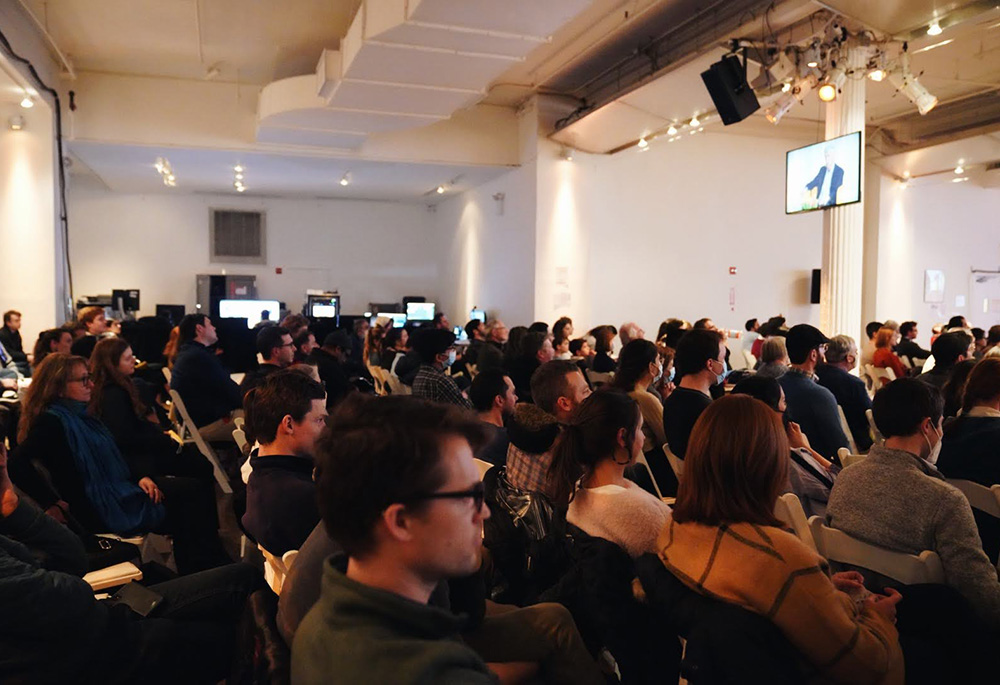 Attendees listen to speakers David Brooks and Francis Collins Feb. 19 during New York Encounter at the Metropolitan Pavilion in New York. The annual cultural event organized by the Communion and Liberation lay movement. (Mariagustina Fabara Martinez)