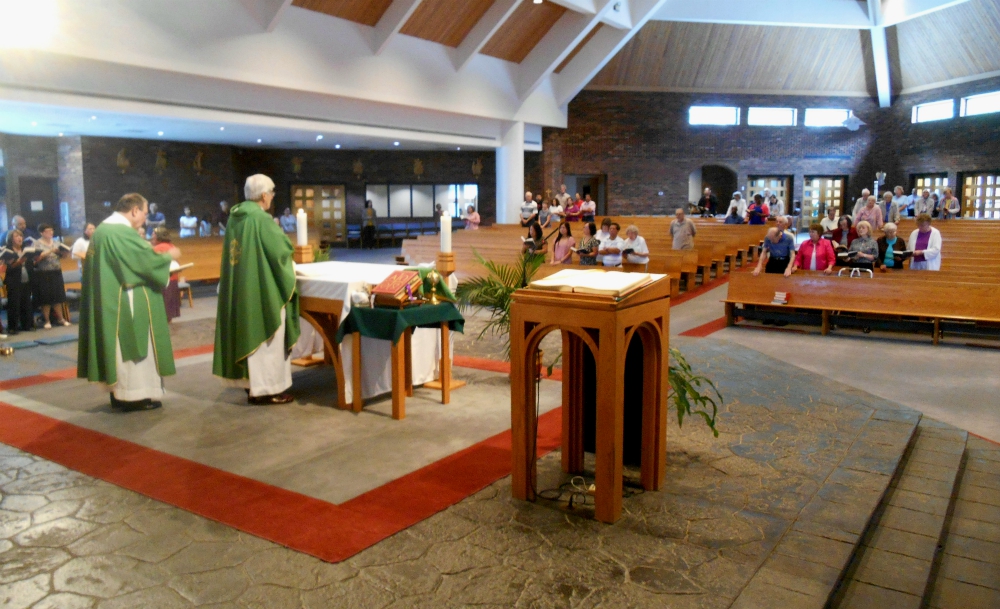 An English-language Mass at Our Lady of the Assumption Parish. With fewer than 100 worshipers, the noise gets swallowed up in the large-ceilinged contemporary church.