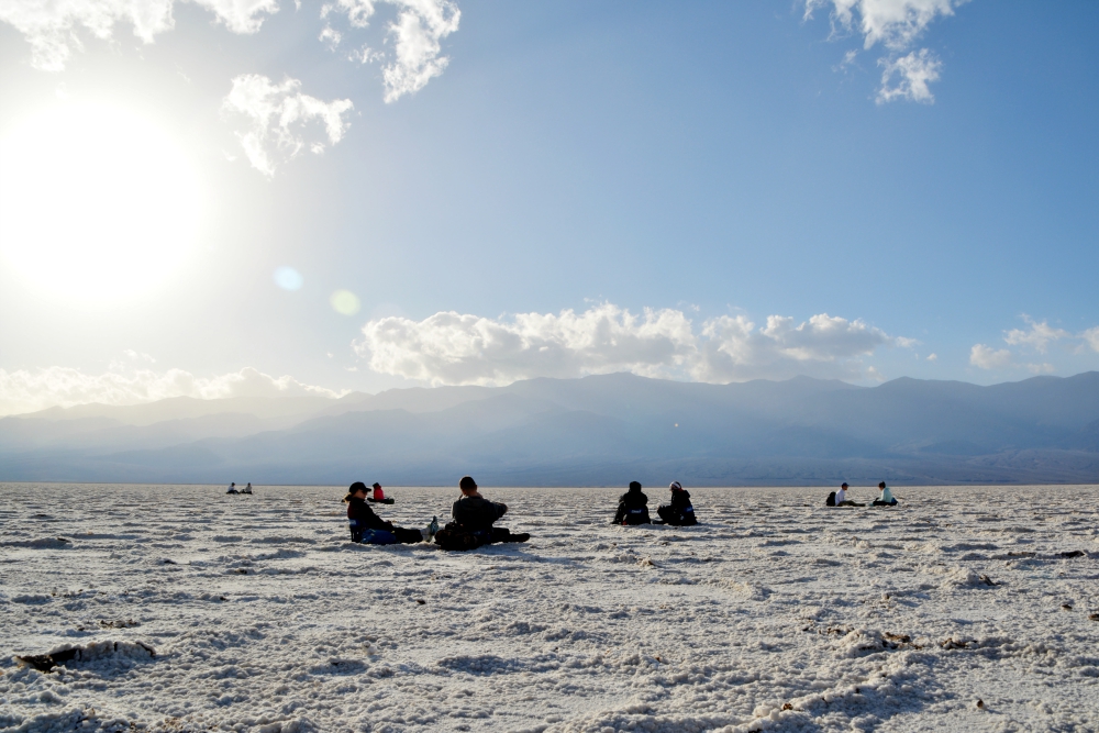 University of Scranton Students practice reflective listening deep within Badwater Basin in Death Valley National Park on A Desert Experience Retreat in December 2017. (Luis Melgar)