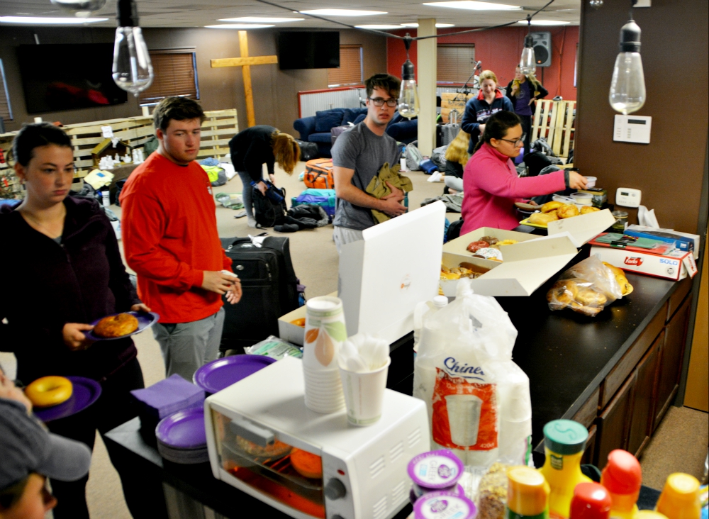 Students find shelter (and doughnuts!) at Holy Spirit Church in Las Vegas after a sandstorm forced them to cut their time in Death Valley short. (Luis Melgar)