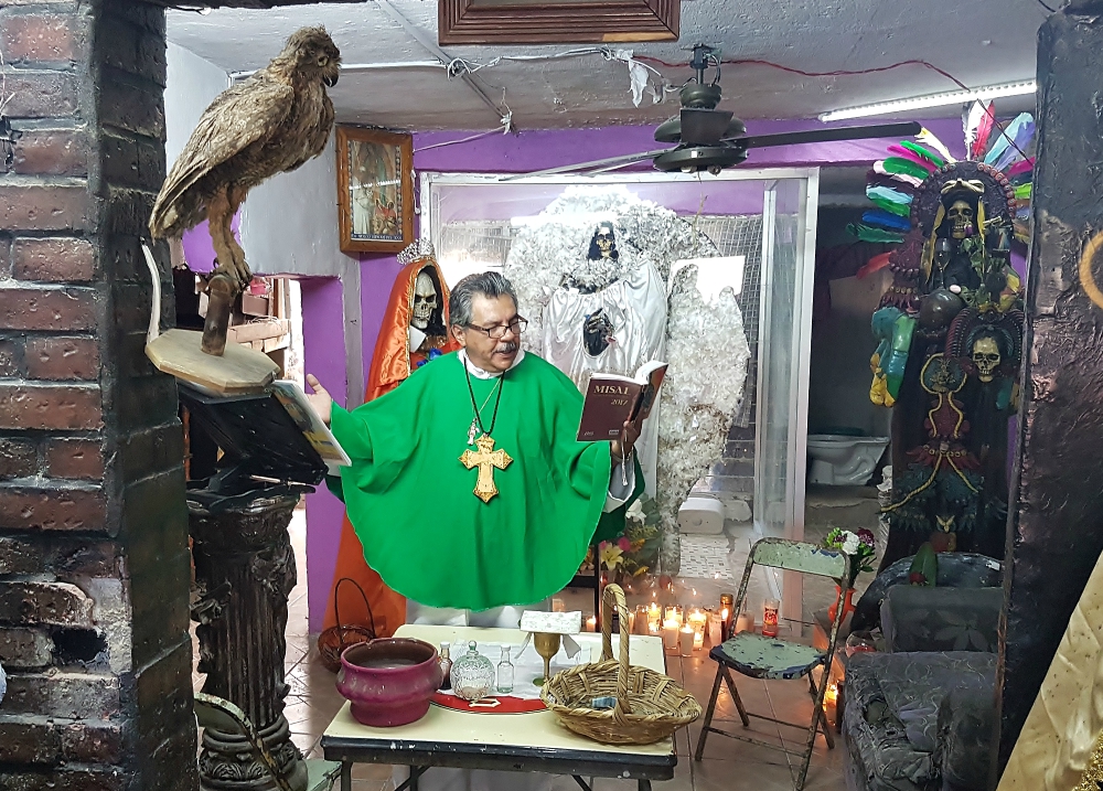 Fr. Daniel Santana, a priest ordained by the Mexican Orthodox Catholic Church, leads Mass at the Santa Muerte Temple in Guadalajara, Mexico. (Stephen Woodman)