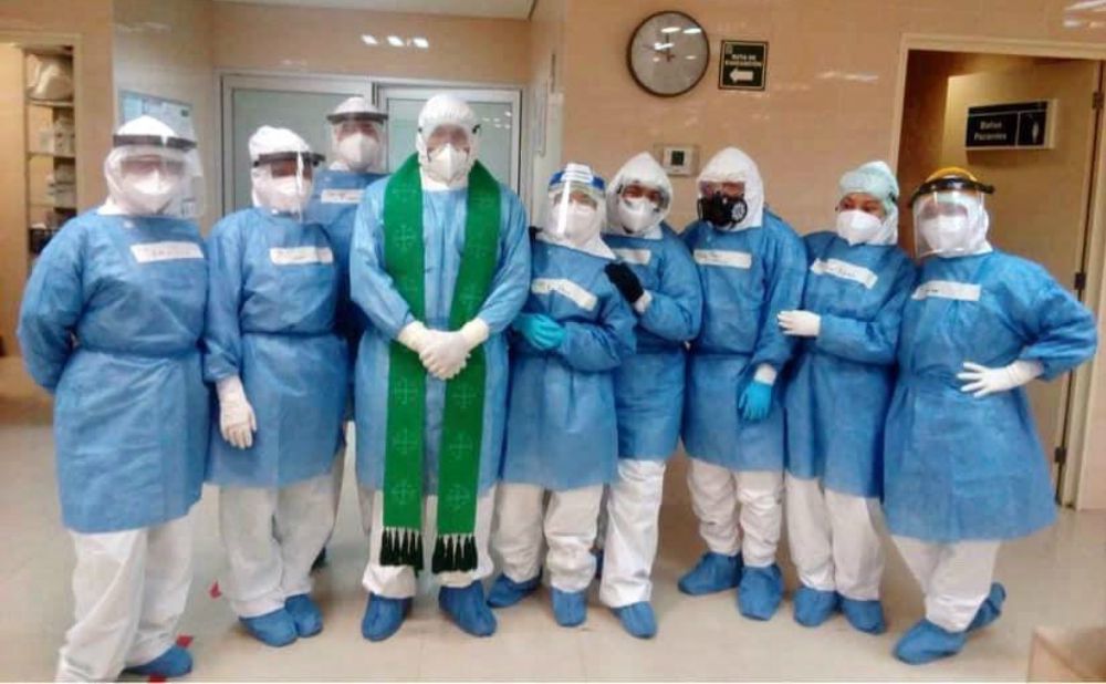 Fr. Humberto Zúñiga Rodríguez poses with health workers at a hospital in Matamoros, Mexico, where he works as a chaplain in the COVID-19 wards. (Courtesy of Matamoros Diocese)