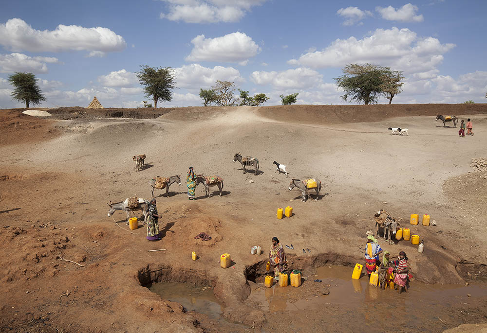 Women search to collect water in Ethiopia's Oromia state, where the in 2016 worst drought in 50 years left rivers and lakes completely dried out. A CRS project in the region works to enhance adaptation to climate change. (Catholic Relief Services)