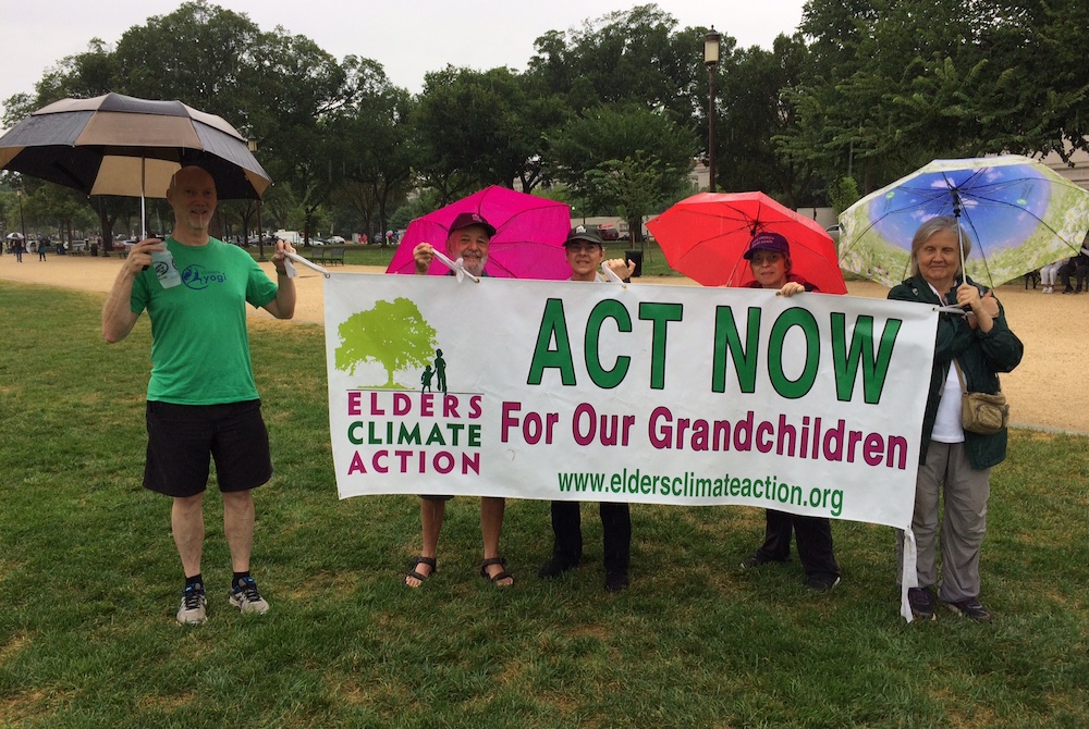 David Mog, second from left, stands with Elders Climate Action co-chair Leslie Wharton, third from left, and other activists represent Elders Climate Action banner at an event in Washington, D.C. July 20, 2018. (Provided photo)