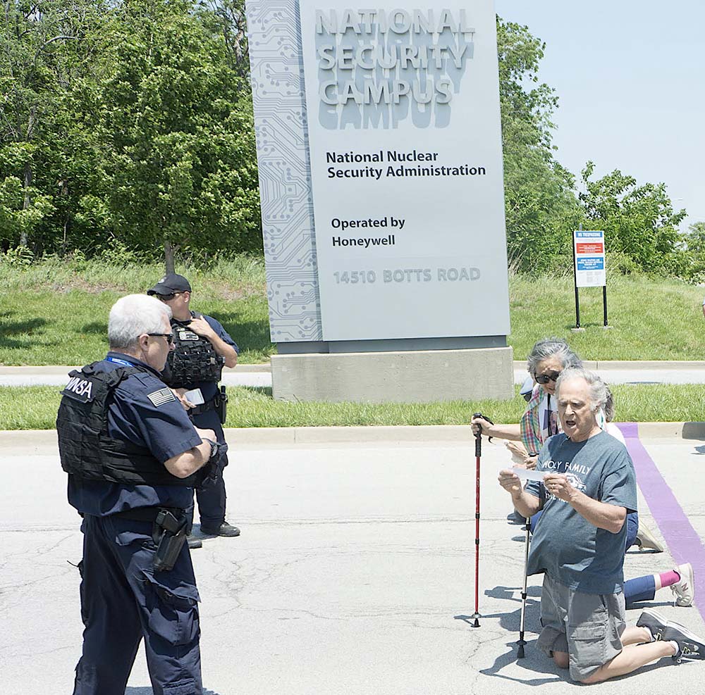 Moments after Tom and Hoa Fox crossed a purple line marking a private entrance to the Kansas City, Missouri, nuclear weapons manufacturing plant, called a "National Security Campus," police moved in to detain them. (Courtesy of Jeff Davis)