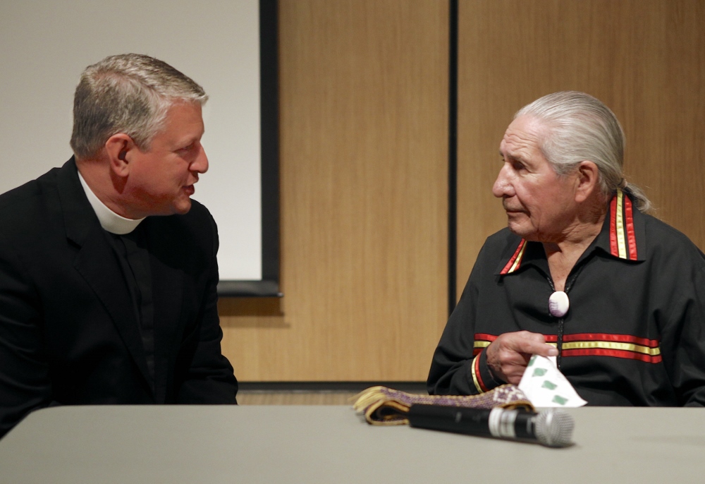 Jesuit Fr. David McCallum, left, and Oren Lyons converse at Le Moyne College in 2013. (Michael Davis)