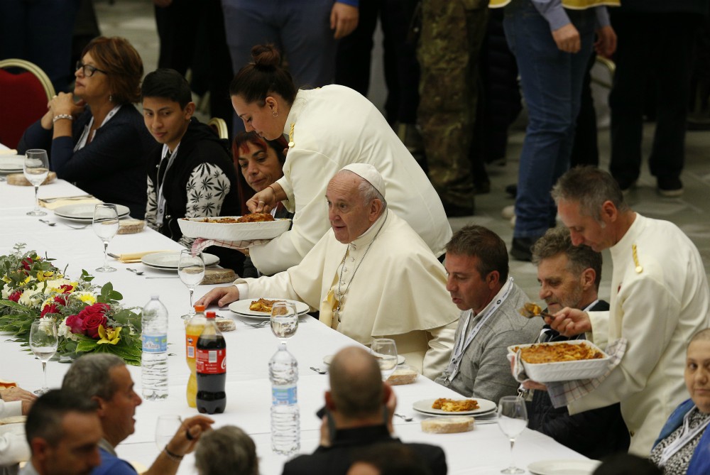 Pope Francis eats lunch with the poor in the Paul VI hall as he marks World Day of the Poor at the Vatican Nov. 17, 2019. (CNS/Paul Haring)