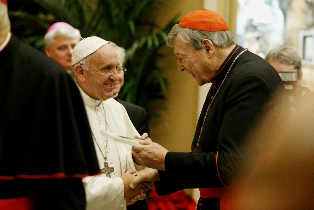 Pope Francis greets Australian Cardinal George Pell during an audience to exchange greetings with members of the Roman Curia in Clementine Hall of the Apostolic Palace at the Vatican Dec. 22, 2016. (CNS/Paul Haring)