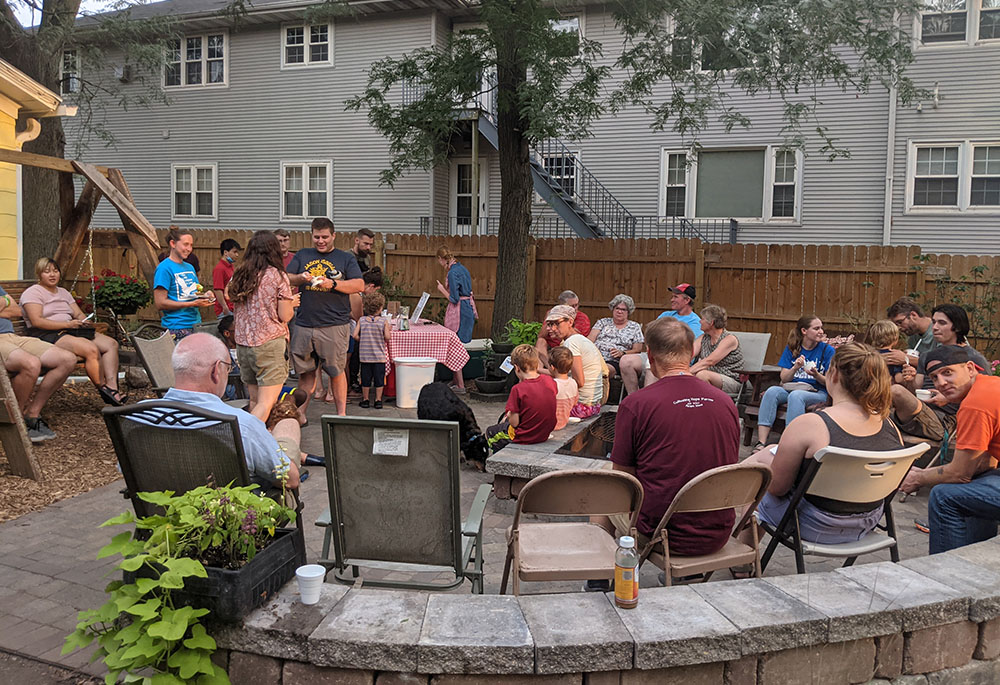 A gathering in the backyard outside at Romero House in Ames, Iowa (Courtesy of Matt Mitchell) A gathering in the backyard outside at Romero House in Ames, Iowa (Courtesy of Matt Mitchell)