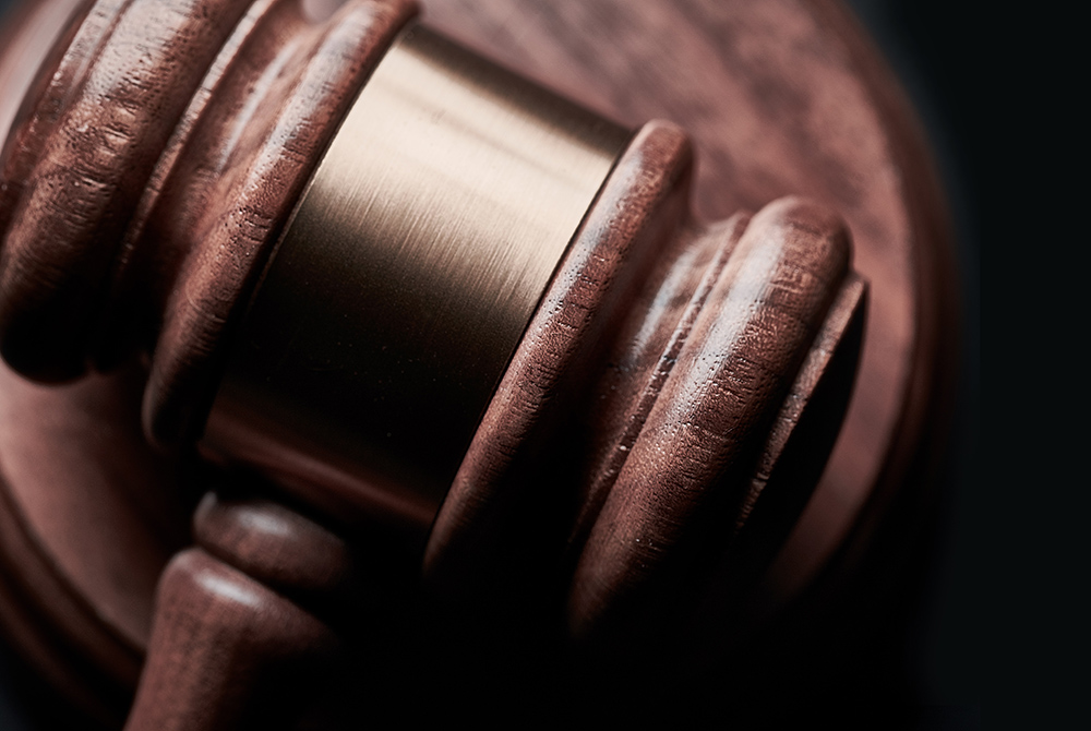 Gavel photo illustration (Unsplash/Bill Oxford)