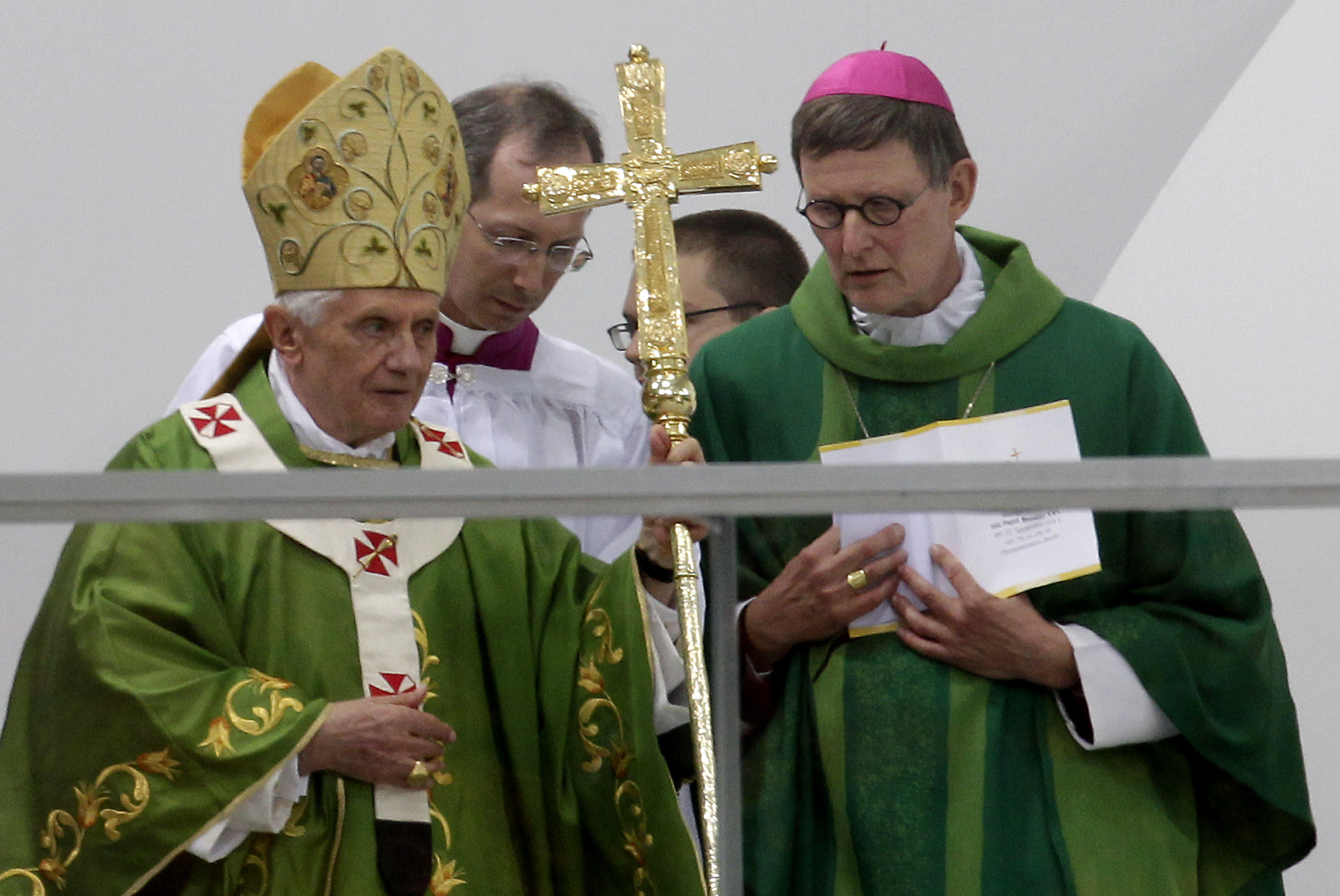 Pope Benedict XVI, left, who retired in 2013, speaking to Berlin's Archbishop Rainer Maria Woelki, right, at a mass at the Olympic Stadium in Berlin, Germany, Jan 6, 2012. (AP Photo/Michael Sohn)