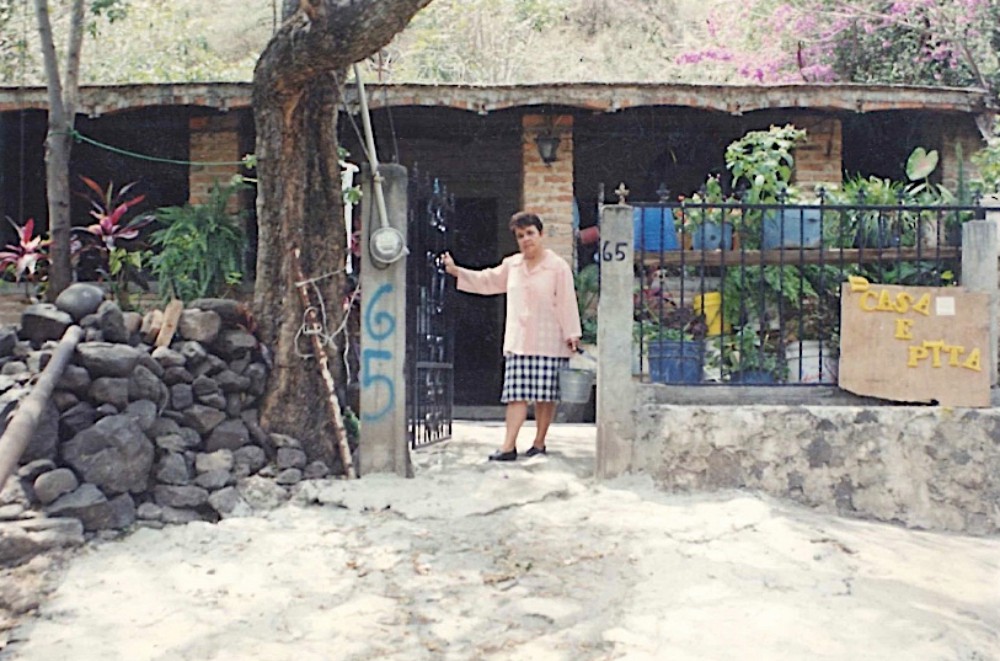 Guadalupe Lara in front of her home in Arcediano, Mexico, before it was razed (Provided photo)