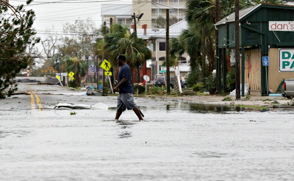 A man walks through a flooded street Oct. 10, 2018, after Hurricane Michael swept through Panama City Beach, Florida. (CNS/EPA/Michael Anderson) A man walks through a flooded street Oct. 10, 2018, after Hurricane Michael swept through Panama City Beach, Florida. (CNS/EPA/Michael Anderson)