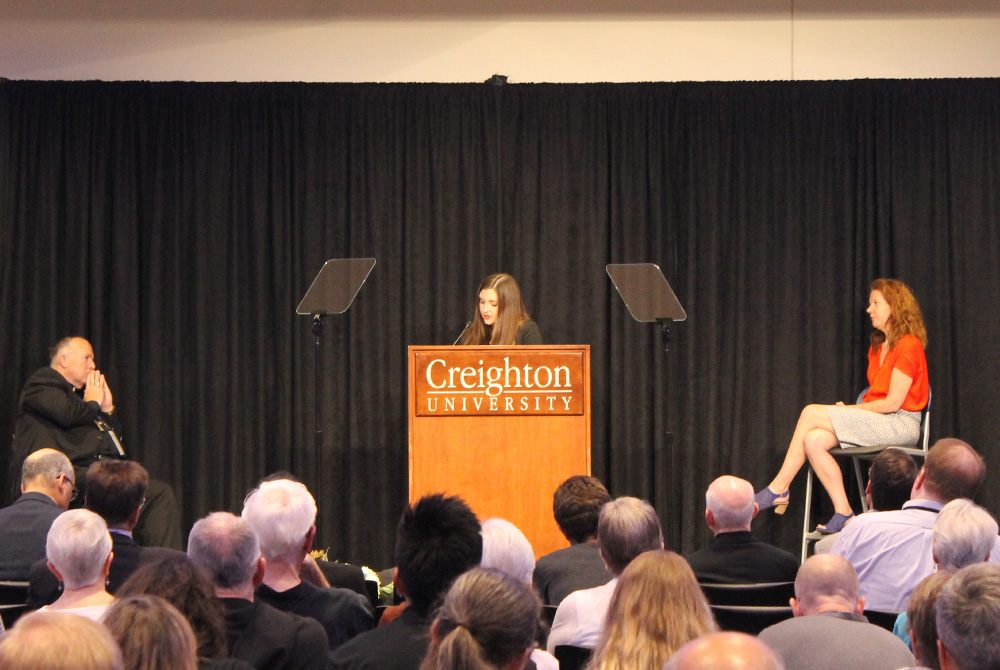 Megan Goodwin, associate director of the U.S. bishops' conference government relations office, speaks during the first "Laudato Si' and the U.S. Catholic Church" conference on June 27, 2019. Listening on stage were San Diego Bishop Robert McElroy and Mart
