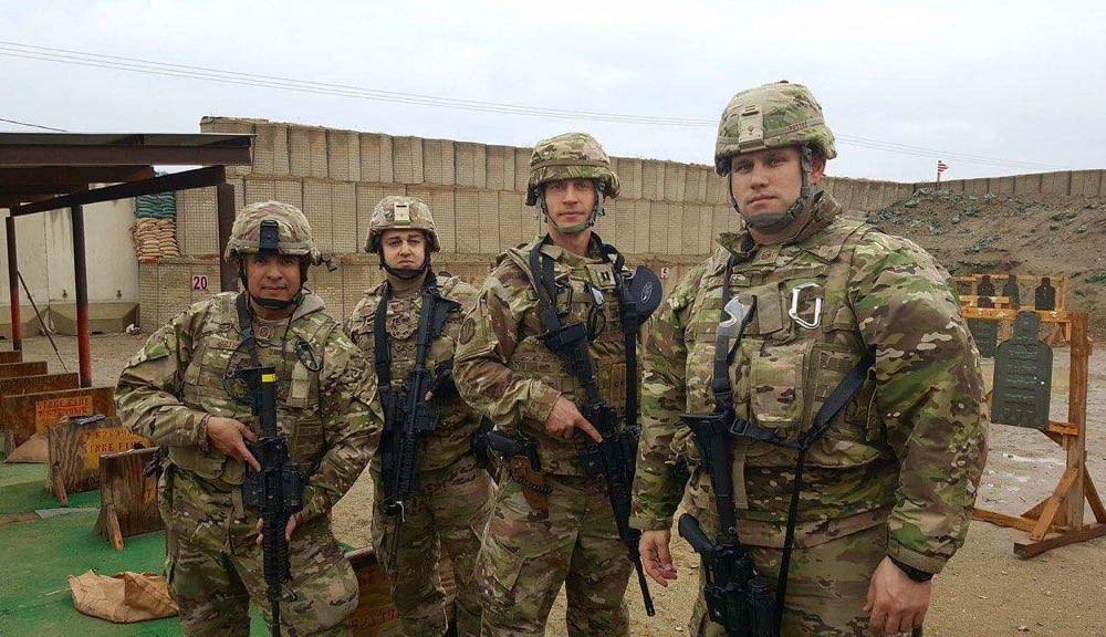 U.S. Air Force Sgt. Chris Pereira, second from left, with three other U.S. Air Force personnel in 2017 at the gun range at Bagram Air Base in Afghanistan (Courtesy of Chris Pereira)