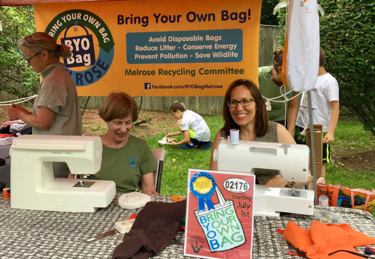 Trudy Macdonald, left, at an event encouraging people to swap reusable bags for single-use plastic bags.