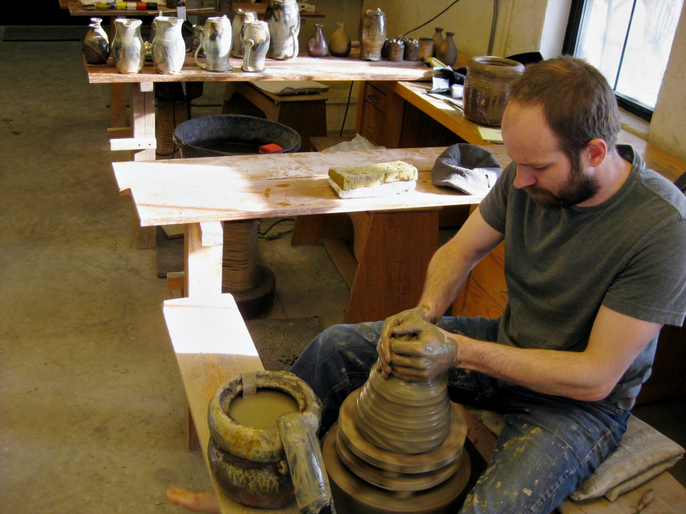 Apprentice Brandon Russell works at the potter's wheel in the St. John's Pottery studio in Collegeville, Minnesota. (Zoe Ryan) Apprentice Brandon Russell works at the potter's wheel in the St. John's Pottery studio in Collegeville, Minnesota. (Zoe Ryan)