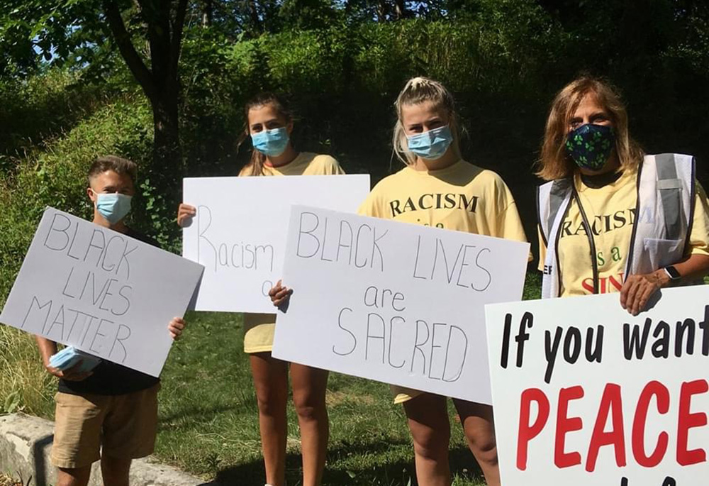 Anne Haines, right, with children Cullen, Danielle and Brianna at a "Black Lives are Sacred" march in Milwaukee (Courtesy of Anne Haines)