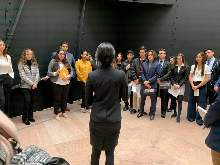 Students from several Jesuit high schools and universities in California meet with a staffer from Kamala Harris' office Nov. 18 in the lobby of the Hart Senate Office Building during the Ignatian Family Teach-In for Justice. (Ignatian Solidarity Network)