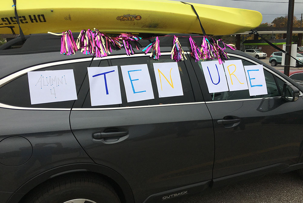 Signs adorn a car in an Oct. 18 alumni caravan protest against changes to the faculty handbook at John Carroll University in the Cleveland suburbs. (Courtesy of Kevin Henderson)