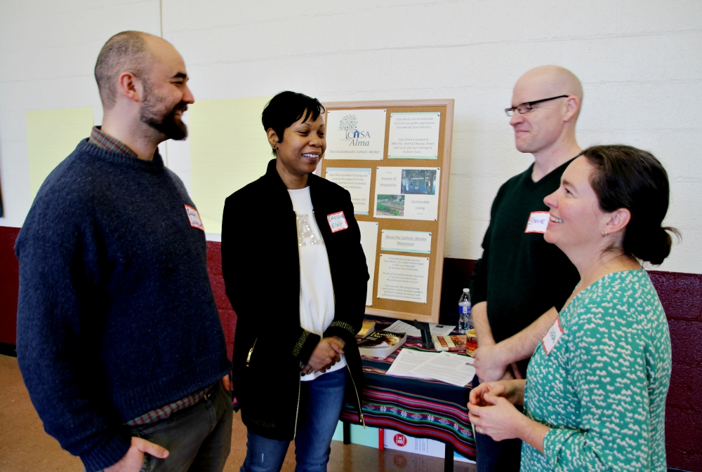 From left: Zachary Johnson, executive director of Call to Action; Crystal King, director of administration of Call to Action; and Steve and Laura Brown of Casa Alma, the Catholic Worker community in Charlottesville (James C. Webster)