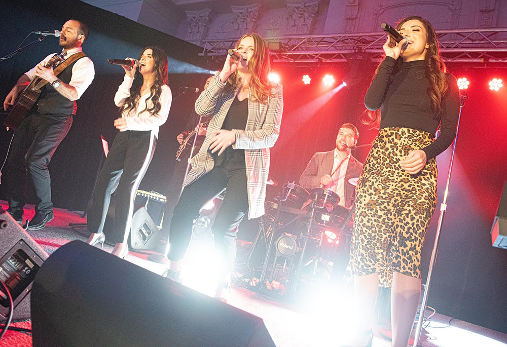 Musicians peform during an Array of Hope event. From left, front row, are Dan Ferrari, Lauren Costabile, Brianne Nealon, and Nicky Costabile; in the back row are Jack Garno on guitar and Jimmy Meier on drums. (Courtesy of Array of Hope/Jeffrey Bruno)