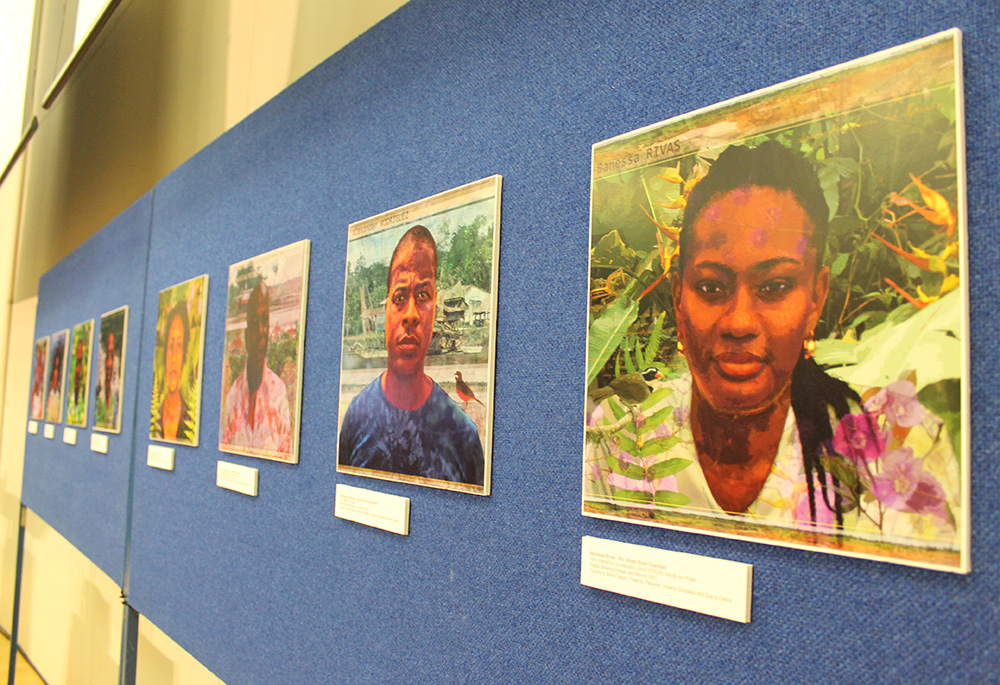 Guardians of the Atrato River are featured in digital portraits during a Nov. 3 event at the University of Glasgow. (NCR photo/Brian Roewe)